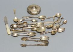 A set of six silver teaspoons and sugar tongs with pierced finials, various other silver spoons,
