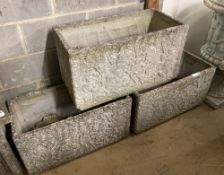 A set of three reconstituted stone rectangular garden planters with claw feet, width 77cm, depth