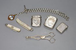 Small silver including a pair of sugar nips, three vesta cases, two fruit knives an albert with gilt