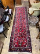 A Hamadan red ground runner, 300 x 84cm