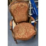 A Victorian mahogany upholstered spoon back upholstered elbow chair, 95cm high, width 63cm