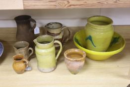 A collection of vintage French stoneware pottery, including a yellow ground bowl and matching