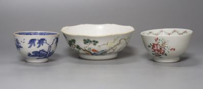 Two Chinese famille rose bowls together with a similar blue and white bowl, largest diameter 14cm