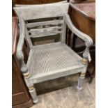 A pair of Dutch colonial style painted cane seat dining chairs, width 55cm, depth 50cm, height 86cmA