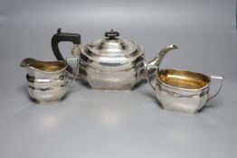 A 1930's silver three piece tea set, W.F. Mitchell, Birmingham, 1936,gross 31oz.