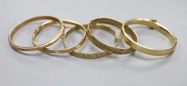 Five assorted modern 9ct gold hinged bangles,73.2 grams.