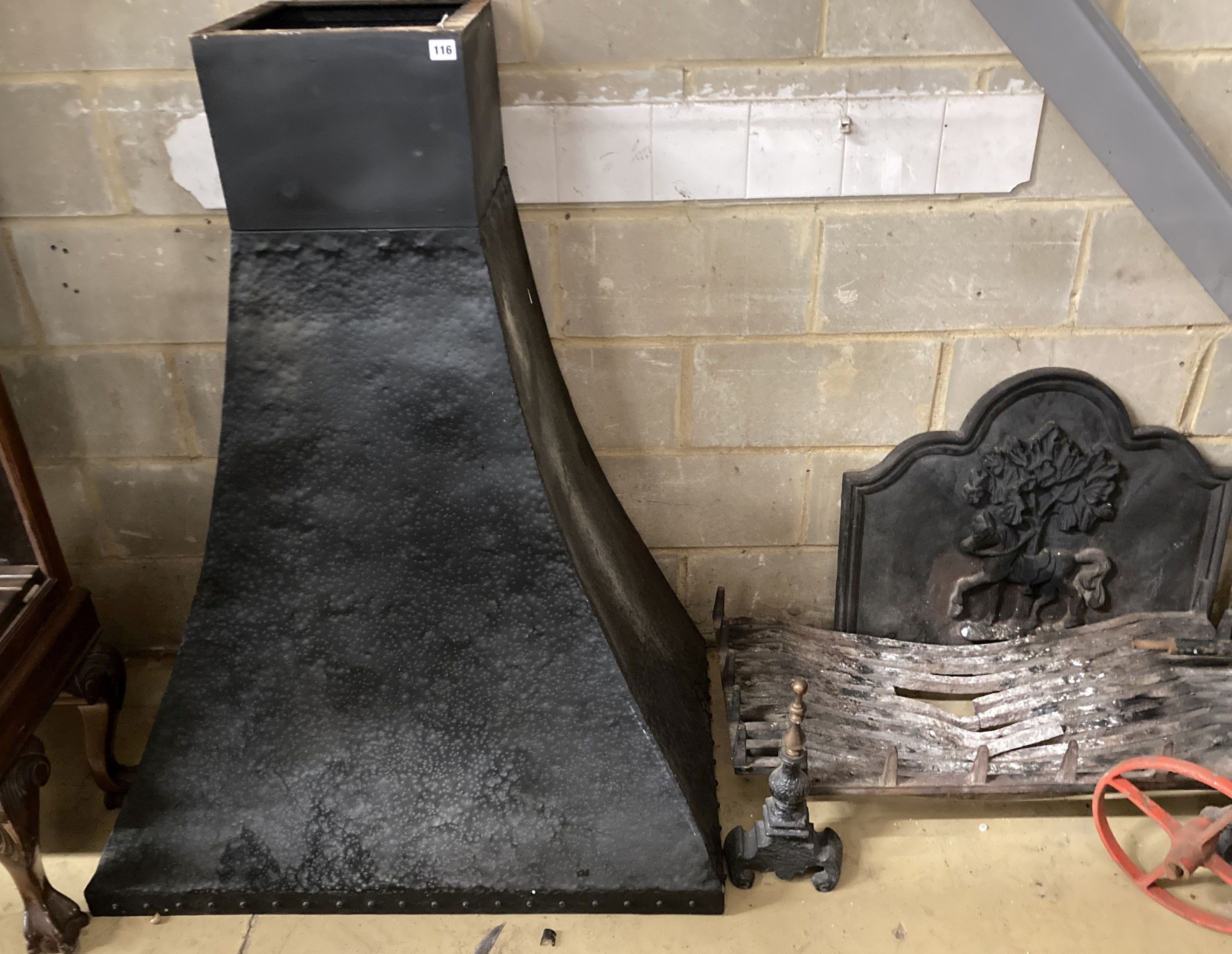 A fireside set comprising of cast iron fire back, basket, width 92cm, height 43cm, pair of dogs