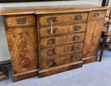 A George III style mahogany breakfront small sideboard, length 138cm, depth 42cm, height 89cm