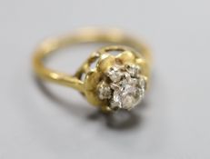 A modern 18ct gold and single stone diamond ring with diamond set border, size L, gross 4 grams.