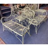 A French painted wrought iron garden suite comprising a pair of benches, length 122cm, depth 62cm,