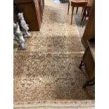 An Agra ivory ground carpet, 440 x 180cm