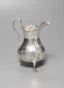 A George III silver cream jug, with later embossed decoration, London, 1767, 10cm, 61 grams.