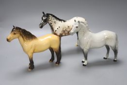 A Beswick Highland pony, a Beswick grey horse and a Royal Doulton Apaloosa, tallest 20cm