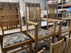 A set of six Arts & Crafts style oak dining chairs (two with arms)