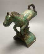 A Chinese Ming 'horse' ridge tile, height 24cm