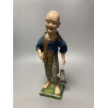 An early 20th century Chinese painted composition figure of a fisherman