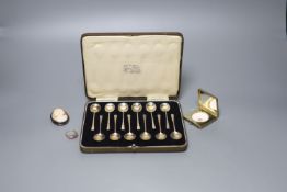 A cased set of twelve George V silver coffee spoons, a silver and enamel compact, cameo brooch and a