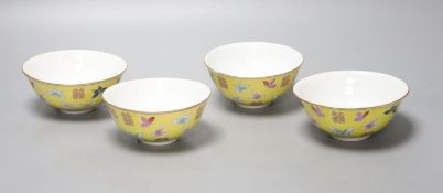 A set of four Chinese yellow ground rice bowls, diameter 11cm