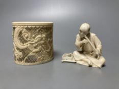 A Japanese ivory okimono of a furniture maker, signed tablet to base, Meiji period and a Chinese