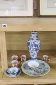 A Chinese blue and white dragon vase, a celadon glazed dish, a blue and white tea bowl and saucer