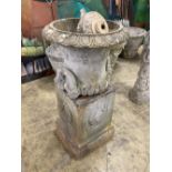 A painted earthenware campana garden urn on square plinth, (in need of repair) 53cm diameter, height