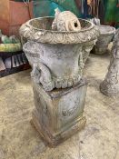 A painted earthenware campana garden urn on square plinth, (in need of repair) 53cm diameter, height