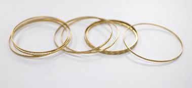 Eight assorted modern 9ct gold bangles,28.1 grams.