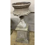 A Victorian style painted cast metal garden urn, 44cm diameter, height 120cm