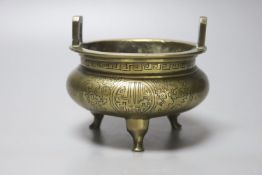 A 19th century Chinese engraved bronze tripod censer, Xuande mark to base, height 11cm