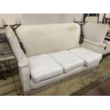 An upholstered Knowle settee, length 184cm, depth 80cm, height 104cm