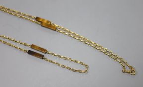 A modern 9ct gold and rectangular tiger's eye quartz baton link necklace, 79cm,gross 14 grams.