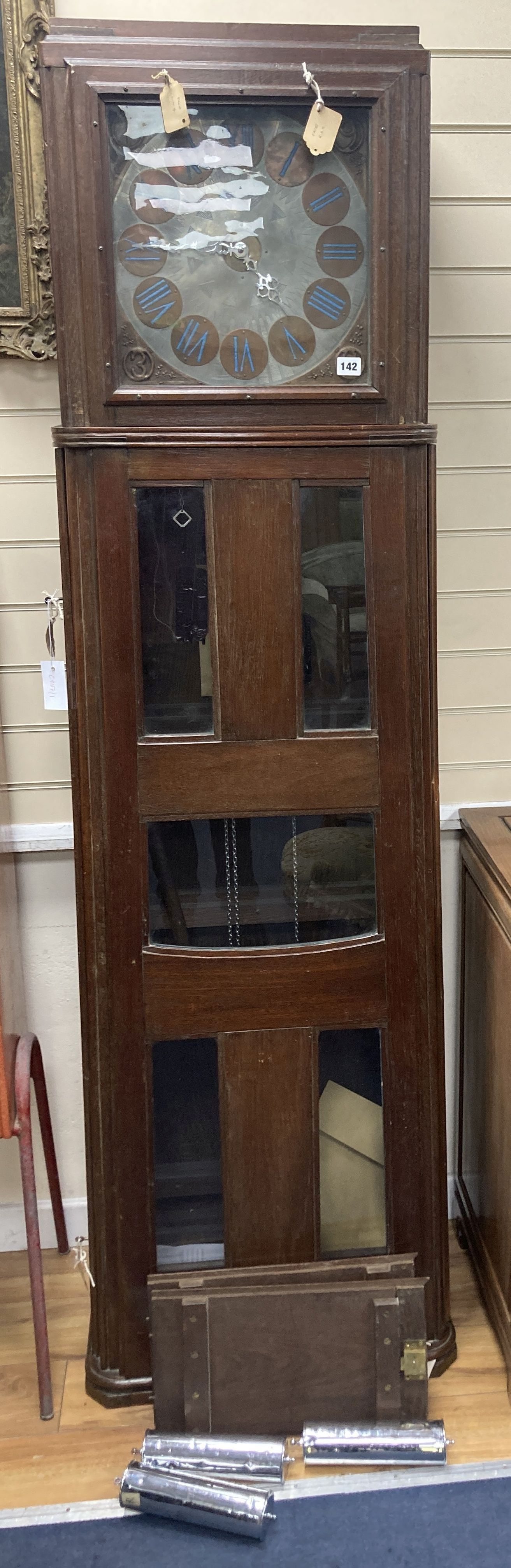 A large and unusual 20th century oak cased longcase clock, in the arts and crafts style, after