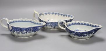 A Worcester Doughnut pattern blue and white sauceboat circa 1775 and two Chinese blue and white