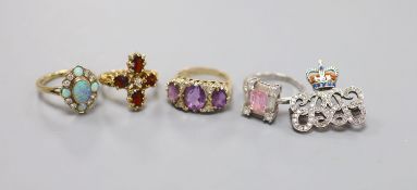 Four assorted modern 9ct gold and gem set dress rings, including amethyst and white opal, gross 16.2