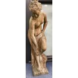 A reconstituted stone garden ornament of a female bather, height 74cm