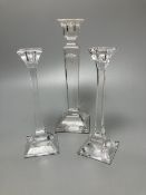 A pair of Tiffany candlesticks and one other (glass), tallest 24.5cm