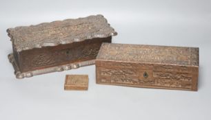 Two 19th century Chinese carved sandalwood boxes, together with a similar puzzle box, length 27cm