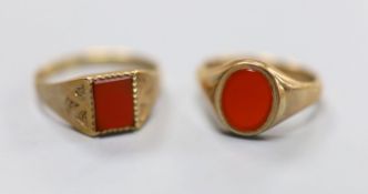 Two modern 9ct gold and carnelian set signet rings, sizes U & Q, gross 6.6 grams.