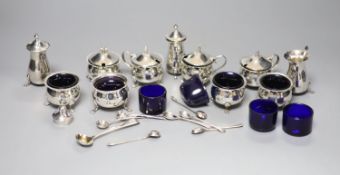 An Edwardian six piece silver condiment set and five other assorted silver condiments.