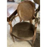 A pair of Louis XVI style caned back fauteuils