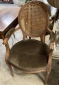 A pair of Louis XVI style caned back fauteuils