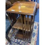 A reproduction inlaid mahogany revolving bookase, width 43cm, height 82cm