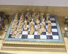 A contemporary chess board and pieces, Egyptian theme