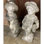 A pair of reconstituted stone garden ornaments, boys with wheatsheaves, larger 87cm high