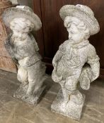 A pair of reconstituted stone garden ornaments, boys with wheatsheaves, larger 87cm high
