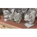 Four reconstituted stone squirrel garden ornaments, largest 26cm high