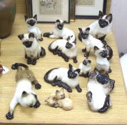Twelve Beswick cats including Siamese