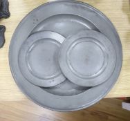 A large pewter charger and two small pewter plates, diameter 46cm, all 18th/19th century