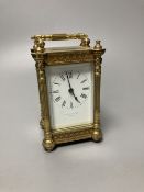An early 20th century French ornate brass carriage timepiece, height 13cm