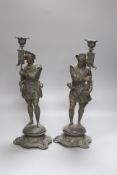 A pair of early 20th century spelter figural candlesticks, height 41cm